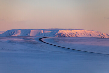 Curved road in mountains in winter