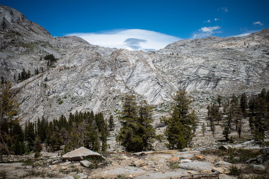 A lenticular cloud forms above an alpine range in Sequoia National Park, California