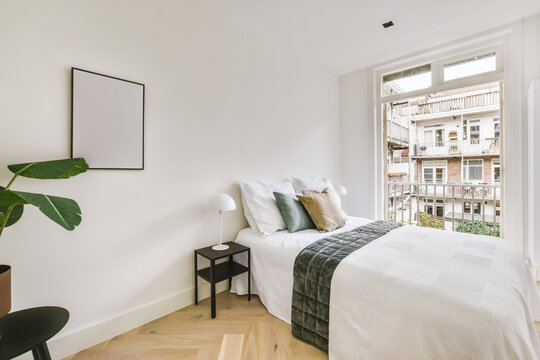 modern white and lighted bedroom with big bed