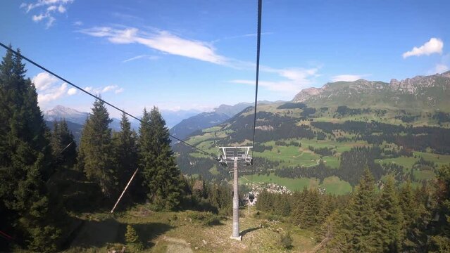 Cable car ride in the canton of Grisons Churwalden. View of the beautiful nature in Switzerland from a gondola lift