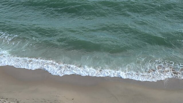 Sea waves crashing against the shore