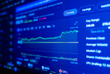 Naklejka premium Stock market upwards chart on the screen. Selective focus.Low angle.