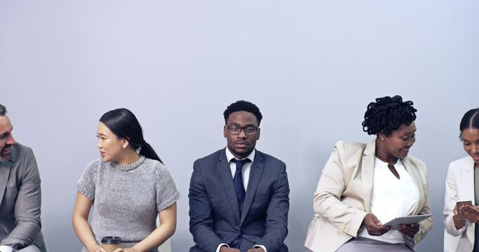 Business man feeling lonely, anxious or worried while waiting in line for an interview. Male candidate in a queue as a shortlist or recruitment candidate for a job or position in a startup company