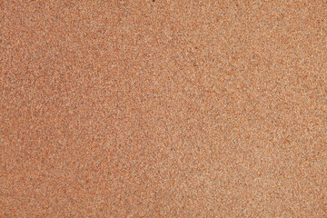 Fototapeta na wymiar The texture of pure sand on the beach or in the desert. There is free space for the text.