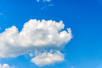 White fluffy clouds in the blue sky background.Cloudy white blue sky in the nice blue heaven sky.