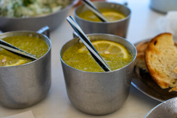 Fresh summer lemonade with citrus in iron cap