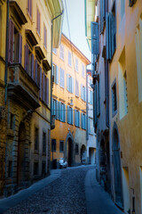 Fototapeta na wymiar Evening Shot of a Narrow Street in the Old City of Bergamo, Italy