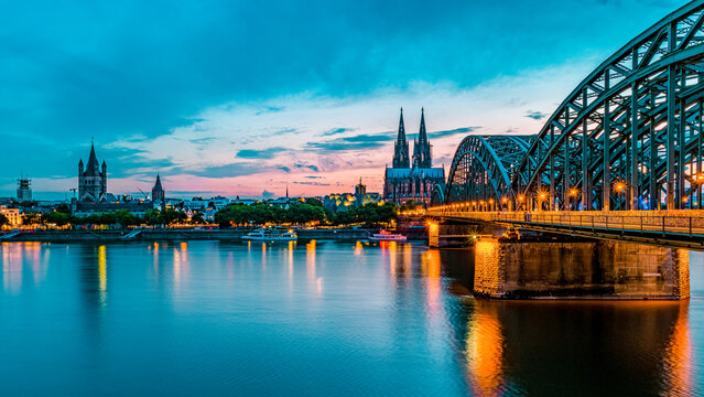 Cologne Koln Germany during sunset, Cologne bridge with the cathedral. beautiful sunset at the Rhine river