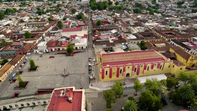 drone shot rotating over the main square, the atrial cross, main plaza, the convent and the municipal palace in san cristobal de las casas in Chiapas Mexico