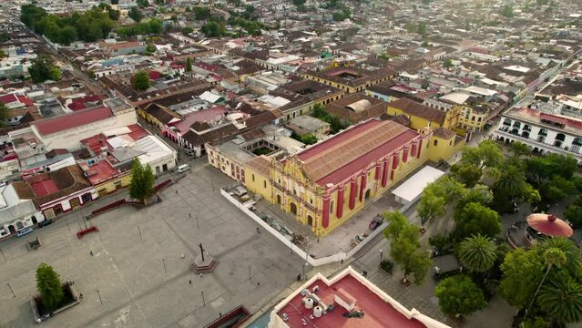 drone shot rotating over the main square, the atrial cross, the convent and the munucipal palace in san cristobal de las casa