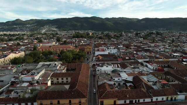 drone shot touring the main avenue and main square and the town of san cristobal de las casa in chiapas, mexico