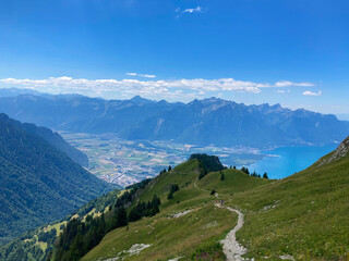 Montreux, Switzerland: 01-08-2022: Panorama of the Switzerland Alpine mountains. Ridges, peaks and lake are visible in the background. Beautiful view in the French Canton.