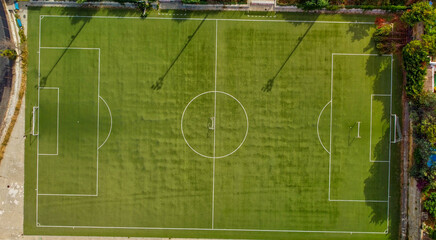 Soccer field in the countryside, aerial view from drone
