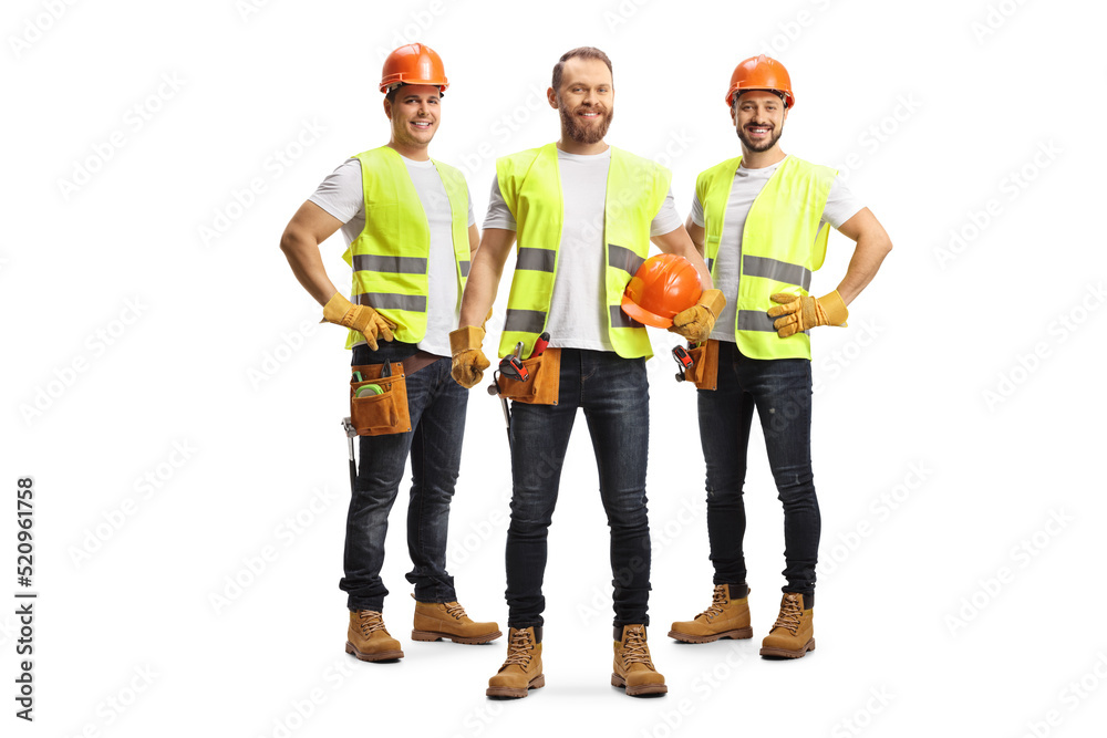 Wall mural Team of male site engineers with safety vests and helmets