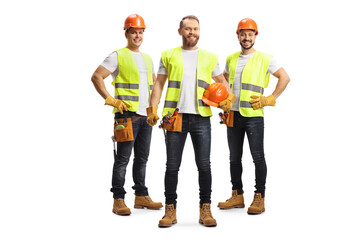Team of male site engineers with safety vests and helmets