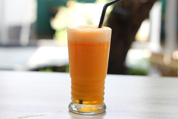 Mango juice in a glass looks very beautiful and delicious