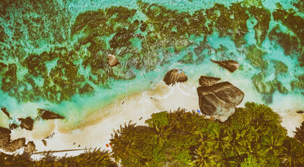 Overhead aerial view of Anse Source Argent Beach in La Digue, Seychelle Islands - Africa
