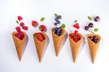 Waffle cones with fresh summer berries