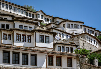 Fototapeta na wymiar Old, white Ottoman Houses on hill in Old Town Berat, Albania