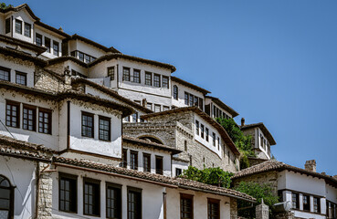 Fototapeta na wymiar Old, white Ottoman Houses on hill in Old Town Berat, Albania
