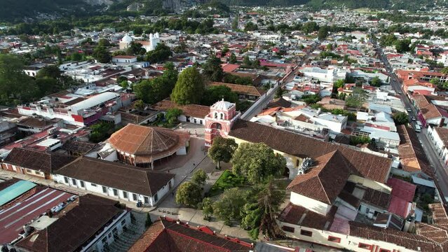drone shot touring the moorish arch of the city of san cristobal de las casas in chiapas mexico in the morning