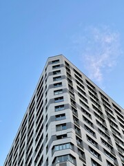 Fototapeta na wymiar Modern office building on blue sky background