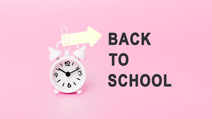 White alarm clock in pink background with text - Back to school. Concept of Time. Banner with alarm clock. Motivational quote