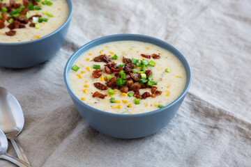 Homemade Corn Chowder with Bacon in Bowls, side view.