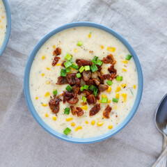 Homemade Corn Chowder with Bacon in Bowls, top view. Flat lay, overhead, from above.