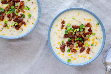 Homemade Corn Chowder with Bacon in Bowls, top view. Flat lay, overhead, from above.
