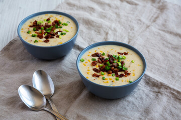 Homemade Corn Chowder with Bacon in Bowls, low angle view.