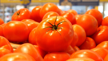 Close-up of many beautiful tomatoes in a supermarket