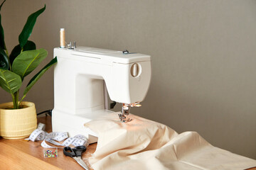 Sewing machine with piece of fabric on table.