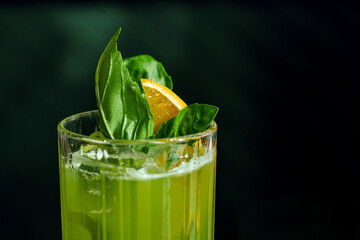 Fresh summer green basil cocktail in a glass - 520970598