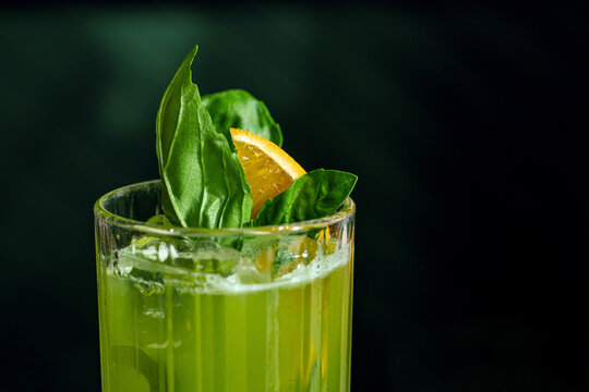 Fresh summer green basil cocktail in a glass
