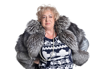 Senior woman in  fur coat  posing