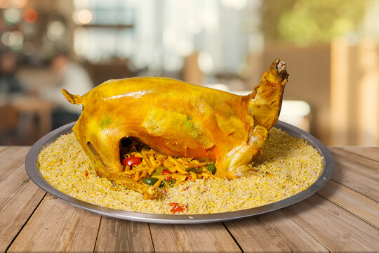 arabic Mutton mandi full mutton with rice on big round plate 
