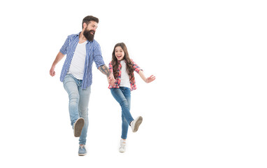 Obraz premium Unstoppable. Energetic daughter and father walk holding hands. Happy family in energetic mood. Photo shoot in studio. Staying energetic and positive. Enjoy fun. Feel pleasure. Energetic and active