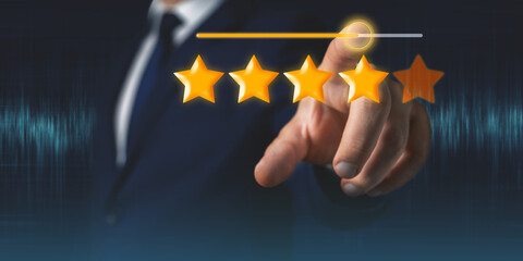 Businessman hand touches four stars from five rating feedback on virtual screen