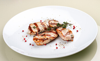 Grilled chicken breast on white background