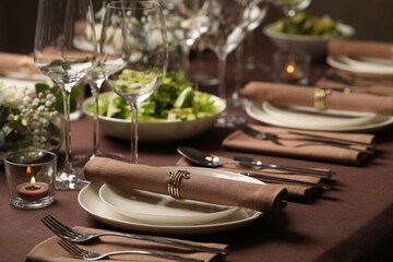 Stylish elegant table setting for festive dinner in restaurant