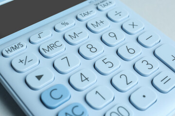 Fototapeta na wymiar Closeup view of white calculator on light background