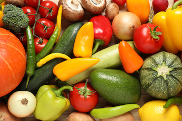 Different fresh vegetables as background, top view