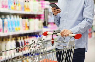 shopping in supermarket.(washing powder,detergent,shampoo, soap)