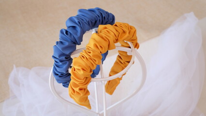 Handmade headband made out of cotton fabric with ruffle style in mustard yellow and dark turquoise color