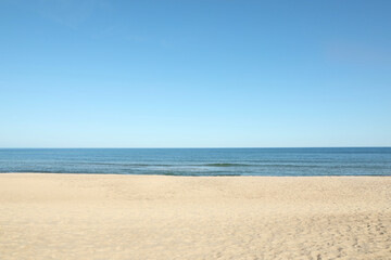 Fototapeta na wymiar Picturesque view of sandy beach near sea