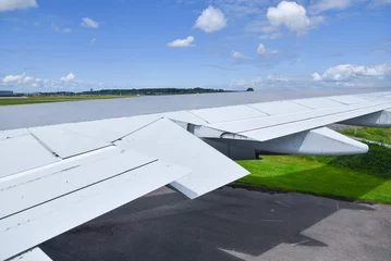 Foto op Canvas Lelystad, Netherlands. July 2022. Close up of the wing of an airplane. © Bert