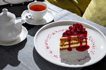 Slice of cake with cherries and cherry jam