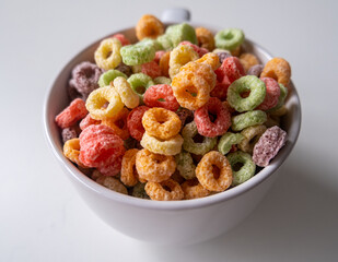 Colored Breakfast colored Cereal in a white Bowl.
