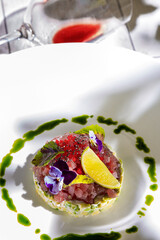 Salad with tuna, lemon, sorrel, violet, sesame, tobiko caviar, sauce, avocado, cucumber and mayonnaise
